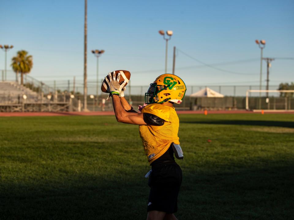 Coachella Valley's Aaron Ramirez makes a catch during practice at Coachella Valley High School in Thermal, Calif., Friday, Aug. 4, 2023. 