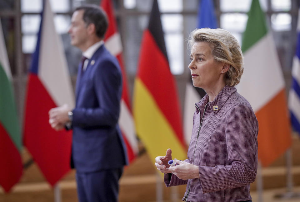 European Commission President Ursula von der Leyen, right, and Belgium's Prime Minister Alexander De Croo speaks with the media as they arrive for an EU summit at the European Council building in Brussels, Thursday, Oct. 15, 2020. European Union leaders are meeting in person for a two-day summit amid the worsening coronavirus pandemic to discuss topics ranging from Brexit to climate and relations with Africa. (Olivier Hoslet, Pool via AP)