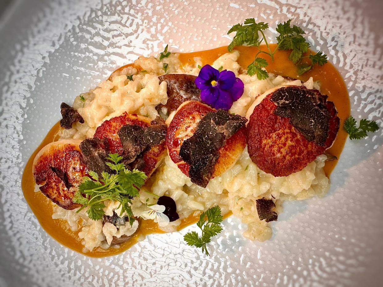 Served at the new Tavolena Italian restaurant in Jupiter: pan-seared diver scallops over cremini mushroom risotto with roasted butternut squash velouté and shaved black truffles.