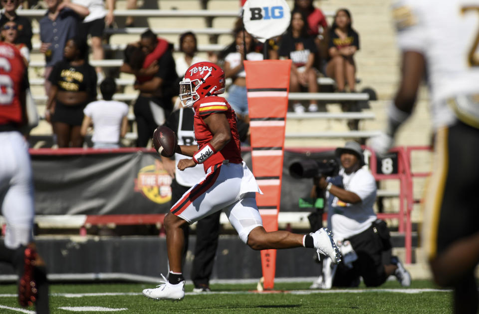 Maryland quarterback Taulia Tagovailoa runs for a touchdown against Towson in the first half of an NCAA football game Saturday, Sept. 2, 2023, in College Park, Md. (AP Photo/Steve Ruark)