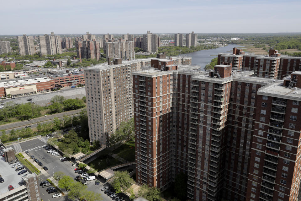 Apartment buildings within Co-op City sit along the banks of the Hutchinson River in the Bronx borough of New York, Tuesday, May 19, 2020. Within the Bronx, almost no place has been hit as hard as Co-op City. Data released by city health officials Monday revealed that the virus has killed at least 155 people living in the zip code that covers the complex. That’s roughly 1 of every 282 residents. (AP Photo/Seth Wenig)