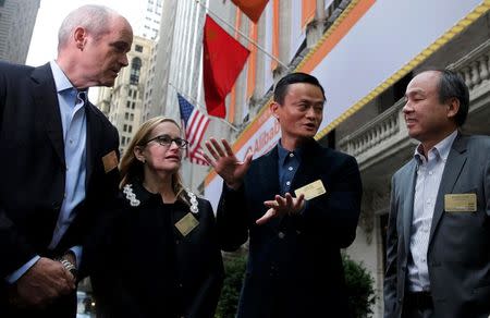 Alibaba Group Holding Ltd founder Jack Ma (2nd R) arrives at the New York Stock Exchange for his company's initial public offering (IPO) under the ticker "BABA" in New York September 19, 2014. REUTERS/Brendan McDermid