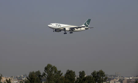 FILE PHOTO - A Pakistan International Airlines (PIA) passenger plane arrives at the Benazir International airport in Islamabad, Pakistan December 2, 2015. REUTERS/Faisal Mahmood