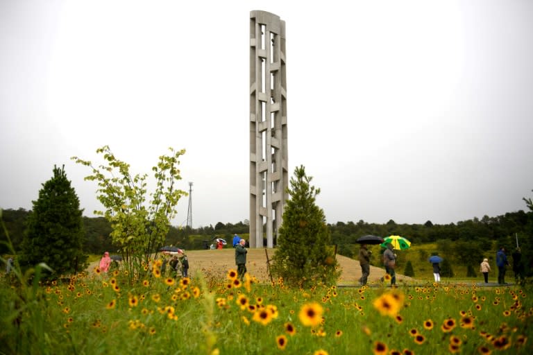 The Tower of Voices stands above visitors, dignitaries and family members of the victims of Flight 93 at the Flight 93 National Memorial Shanksville, Pennsylvania