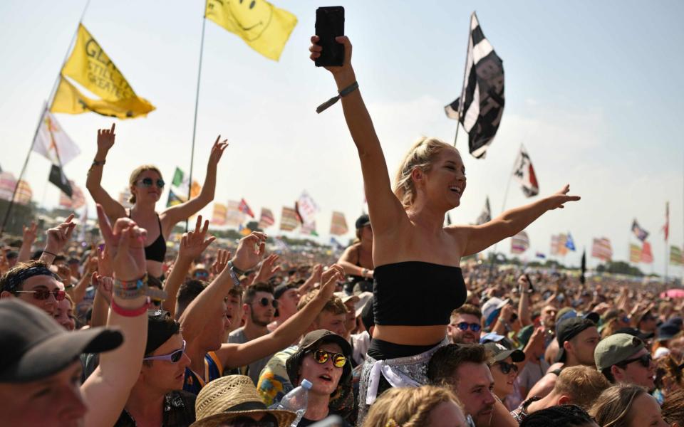 Revellers enjoy the performance of Scottish singer song-writer Lewis Capaldi at the Glastonbury Festival of Music and Performing Arts on Worthy Farm near the village of Pilton in Somerset, South West England, on June 29, 2019. - AFP