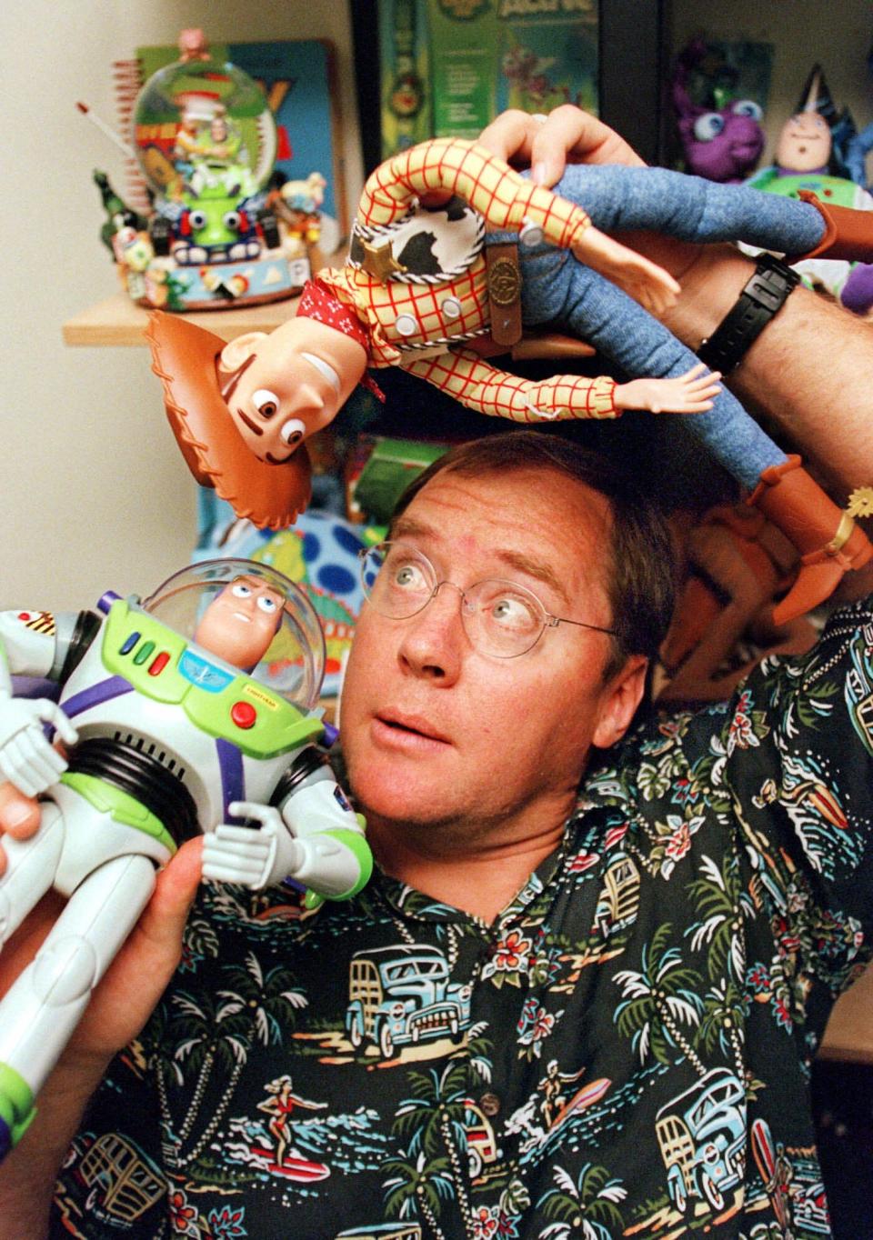 John Lasseter with Buzz and Woody