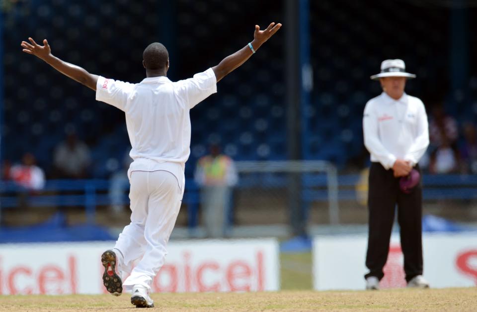 West Indies bowler Kemar Roach (L) appea