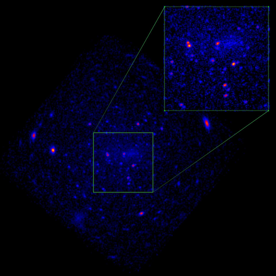 A dark image of an oblong purple blob in space. Two areas are highlighted with white squares.