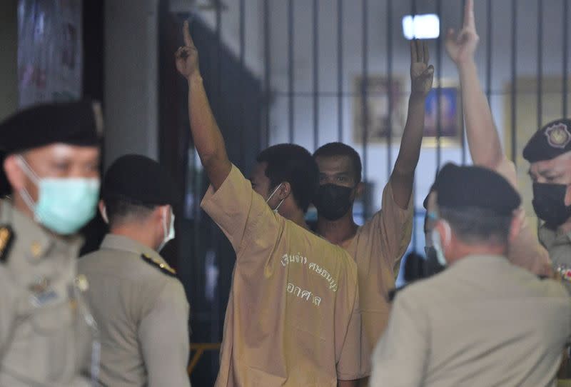 FILE PHOTO: Arrested anti-government protesters arrive at criminal court to face lese majeste charges in Bangkok