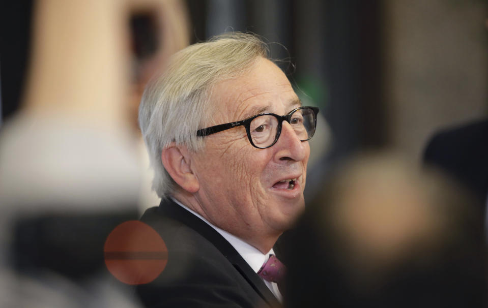 European Commission President Jean-Claude Juncker speaks with the media as he leaves an EU summit in Brussels, Friday, June 21, 2019. EU leaders concluded a two-day summit on Friday in which they discussed, among other issues, the euro-area. (AP Photo/Olivier Matthys)