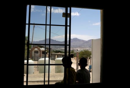 Central American migrants are seen at the 'Aposento Alto' provisional shelter after returning to Mexico from the U.S. under the Migrant Protection Protocol (MPP) to wait for their court hearing for asylum seekers, on the outskirts of Ciudad Juarez