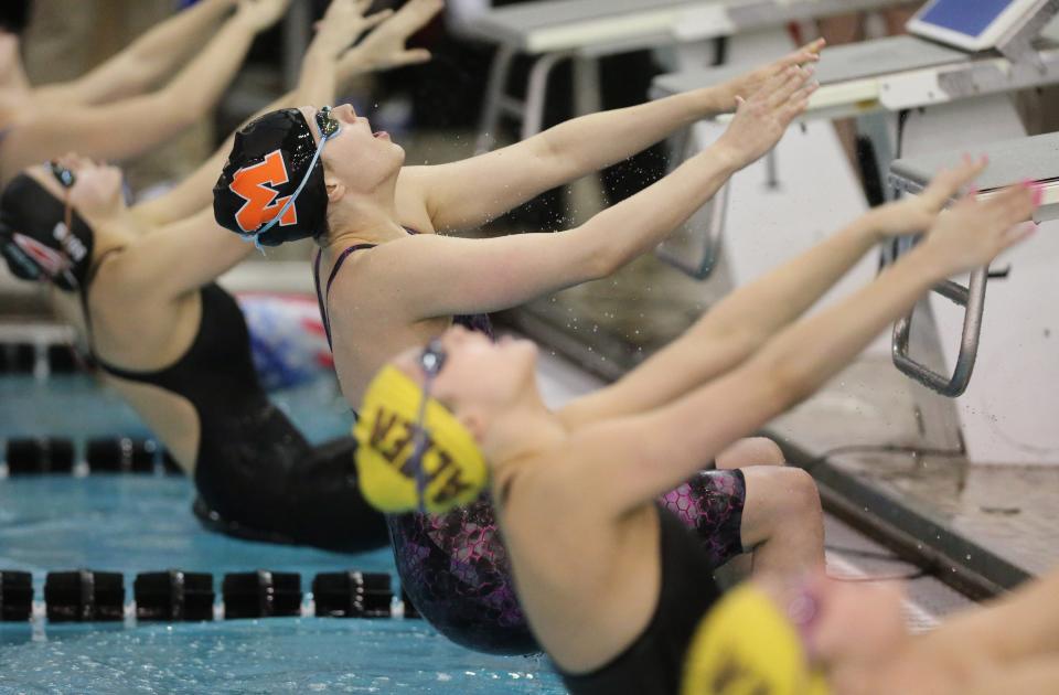 Leah Guess of Marlington takes off in the DII girls 100 yard backstroke prelims during the state swimming and diving championships at C.T. Branin Natatorium in Canton on Thursday, Feb. 24, 2022.