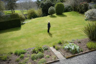 Curator Britannia Museum Royal Naval College, Dr Jane Harrold stands in the 'Captain's Garden' at Britannia Royal Naval College in Dartmouth, Devon, exactly where the Duke of Edinburgh first met the Queen whilst training as a young naval cadet, England, Monday, April 12, 2021. Britain's Prince Philip, the irascible and tough-minded husband of Queen Elizabeth II who spent more than seven decades supporting his wife in a role that mostly defined his life, died on Friday. (Ben Birchall/PA via AP)