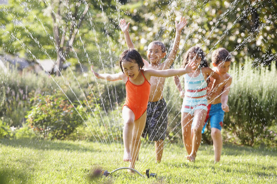 Splash out for these cheap sprinkler water toy accessories for the kiddos this summer. (Photo: Ariel Skelley via Getty Images)