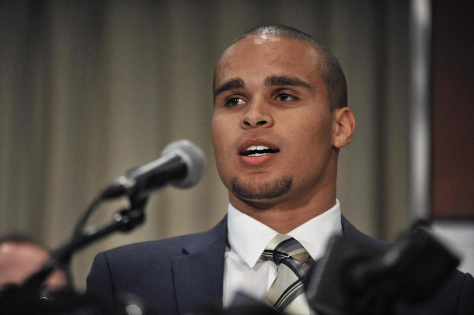 CORRECTS SPELLING TO COLTER, INSTEAD OF COULTER - Northwestern quarterback Kain Colter speaks during a news conference in Chicago, Tuesday, Jan., 28, 2014. Calling the NCAA a "dictatorship," a handful of Northwestern football players announced Tuesday they are forming the first labor union for college athletes, the College Athletes Players Association. (AP Photo/Paul Beaty)