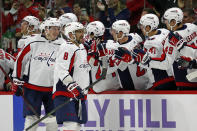 Washington Capitals' Alex Ovechkin (8) celebrates his goal along the bench during the second period of an NHL hockey game against the Carolina Hurricanes in Raleigh, N.C., Sunday, Nov. 28, 2021. (AP Photo/Karl B DeBlaker)