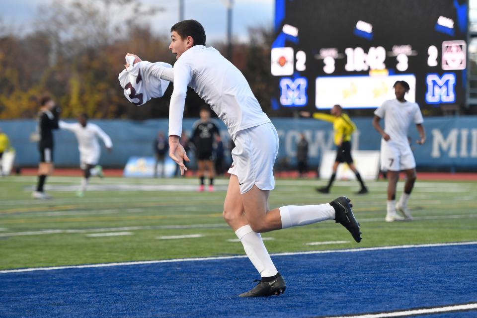 Aquinas' John Leary celebrates after scoring the game-winning goal during the Class A final at the NYSPHSAA Boys Soccer Championships in Middletown, N.Y., Saturday, Nov. 11, 2023. Aquinas won the Class A title with a 3-2 double overtime win over Byram Hills-I.