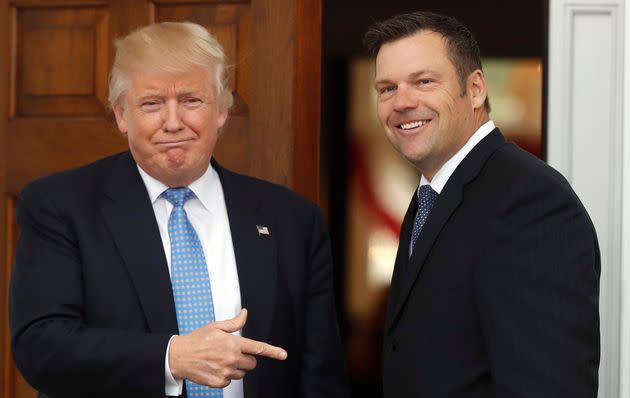 Former President Donald Trump greets then-Kansas Secretary of State Kris Kobach, as he arrives at the Trump National Golf Club Bedminster clubhouse in Bedminster, N.J. (Photo: via Associated Press)