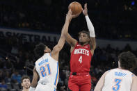 Houston Rockets guard Jalen Green (4) shoots over Oklahoma City Thunder guard Aaron Wiggins (21) in the first half of an NBA basketball game Saturday, Feb. 4, 2023, in Oklahoma City. (AP Photo/Sue Ogrocki)