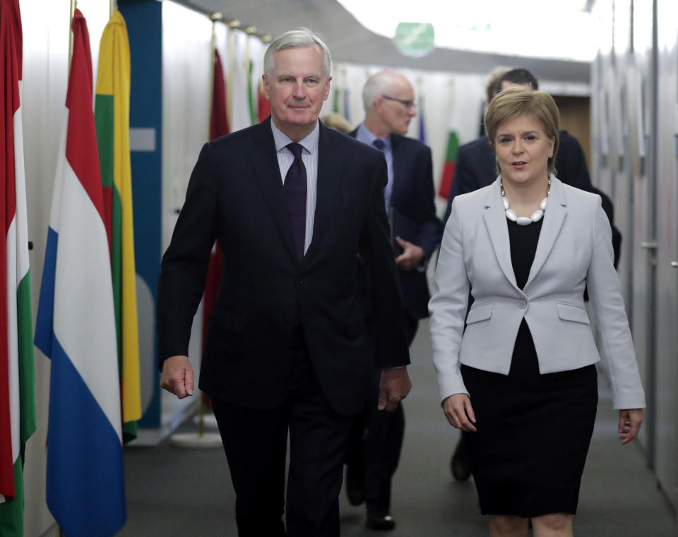 European Union chief Brexit negotiator Michel Barnier, left, walks with Scotland's First Minister Nicola Sturgeon prior to a meeting at EU headquarters in Brussels Tuesday, June 11, 2019. (Olivier Hoslet, Pool Photo via AP)