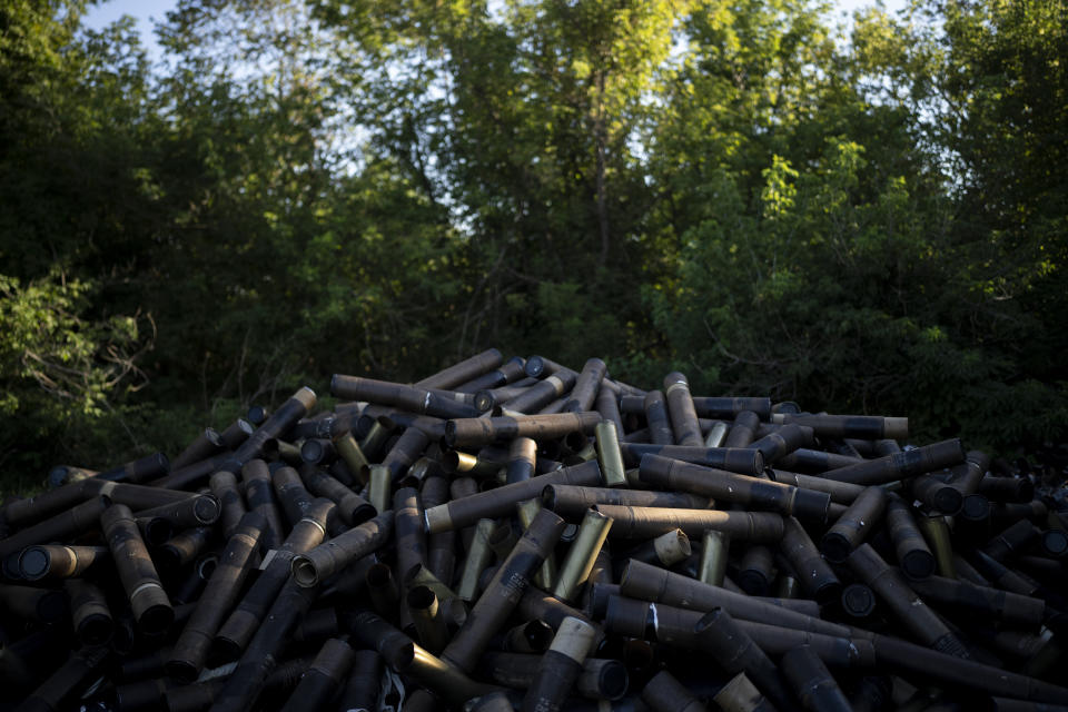 FILE - Spent shells lay piled up on the front line in the outskirts of Lyman, Ukraine, Tuesday, Aug. 15, 2023. Moscow’s army is staging a ferocious push in northeast Ukraine designed to distract Ukrainian forces from their counteroffensive and minimize the number of troops Kyiv is able to send to more important battles in the south. (AP Photo/Bram Janssen, File)