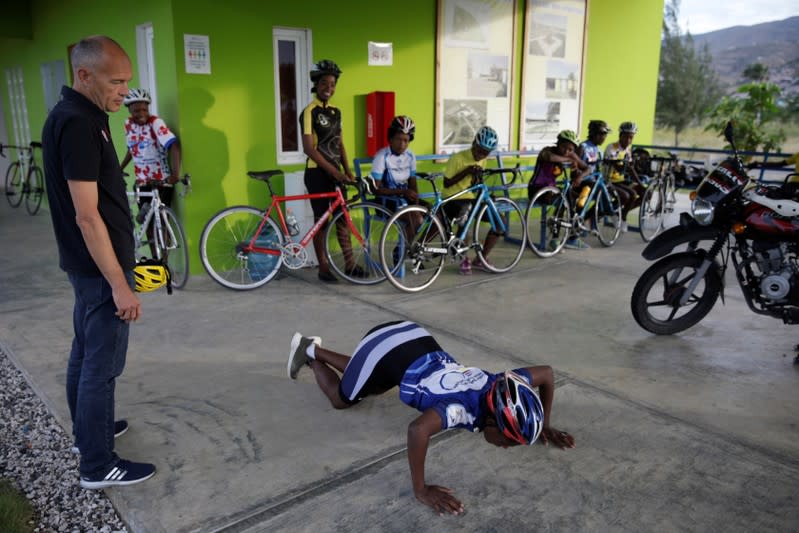 The Wider Image: Haiti's cyclists brave protests and poor roads in race for gold