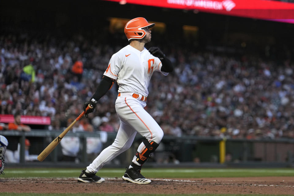 San Francisco Giants' Tommy La Stella watches his three-run home run against the New York Mets during the fourth inning of a baseball game in San Francisco, Tuesday, May 24, 2022. (AP Photo/Tony Avelar)