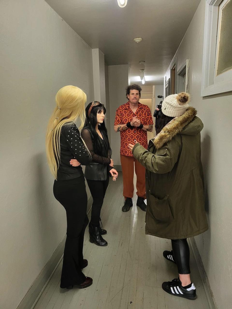 Aurora High School graduate Nicole Ice, right, gives direction for a chase scene in a hallway of a Columbiana apartment building during production of the science fiction comedy "Gemini" in April 2023. From left are cast members Cara DeChurch, Angela Cole and John Yuhas.