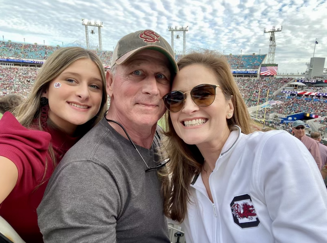 Mike Hold (Center) with his wife, Nicole (Right) and his daughter, Hudsen (Left) at the 2023 Gator Bowl.