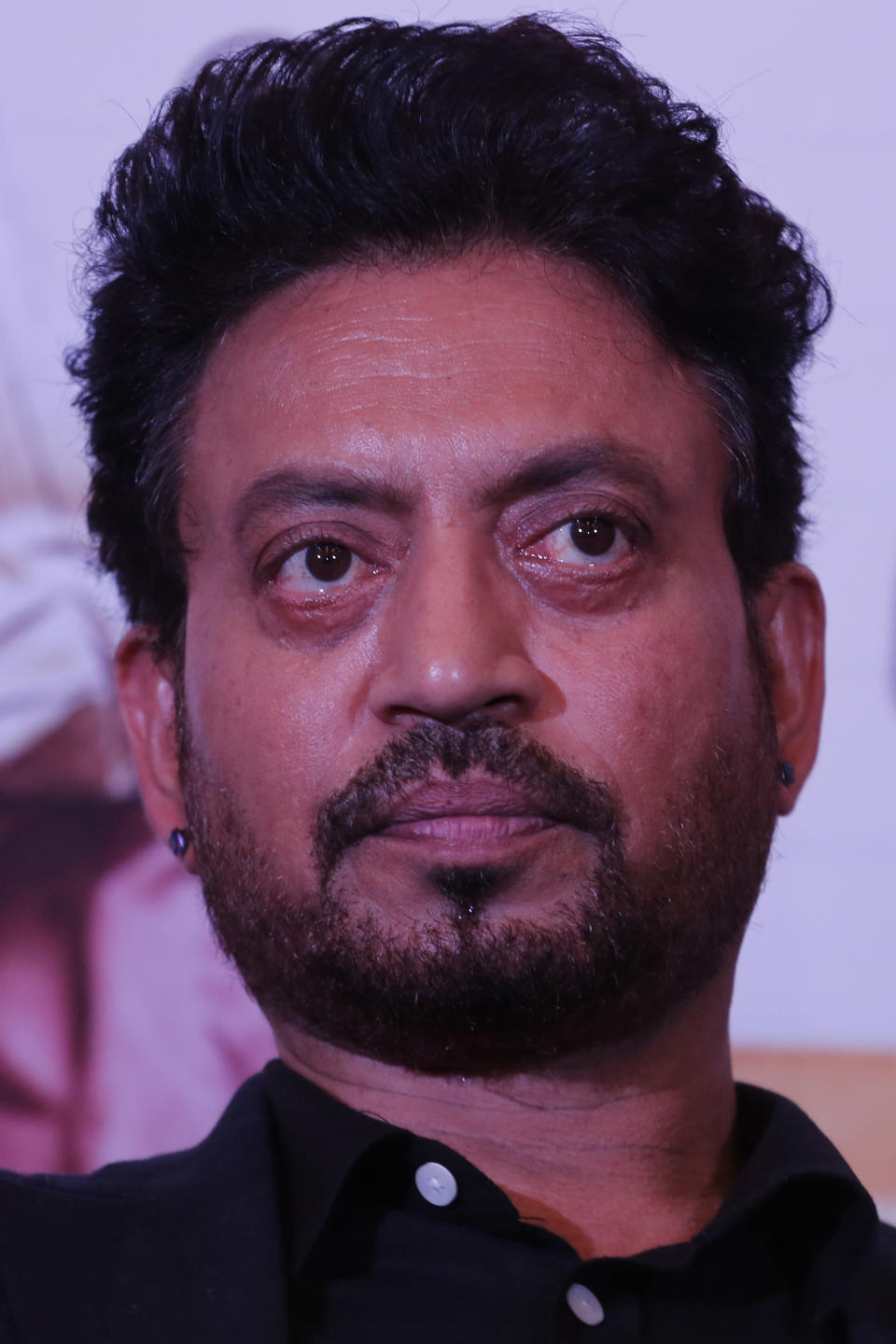 FILE- In this May 17, 2017 file photo, Bollywood actor Irrfan Khan looks on during a press conference to promote his movie "Hindi Medium" in Ahmadabad, India. Khan, a veteran character actor in Bollywood movies and one of India's most well-known exports to Hollywood, has died. He was 54. (AP Photo/Ajit Solanki, File)