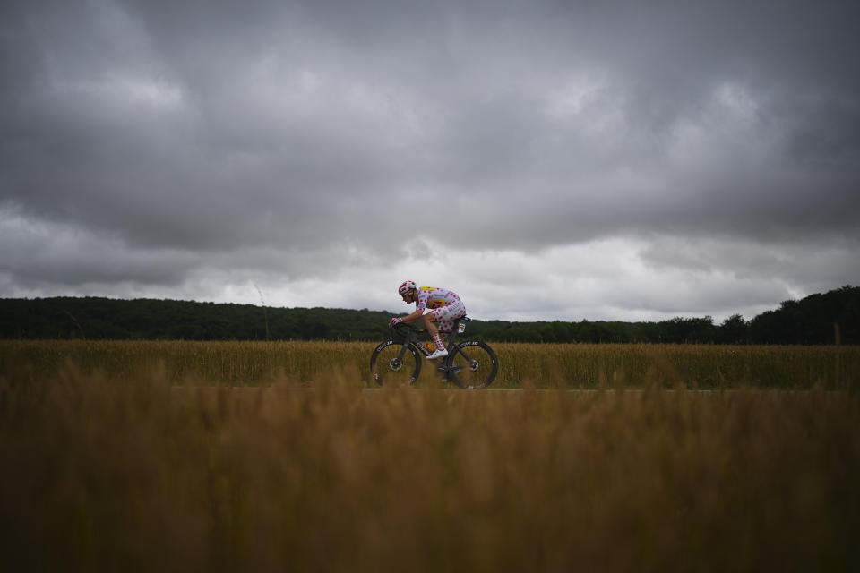 Norway's Jonas Abrahamsen, wearing the best climber's dotted jersey, rides breakaway during the eighth stage of the Tour de France cycling race over 183.4 kilometers (114 miles) with start in Semur-en-Auxois and finish in Colombey-les-Deux-Eglises, France, Saturday, July 6, 2024. (AP Photo/Daniel Cole)