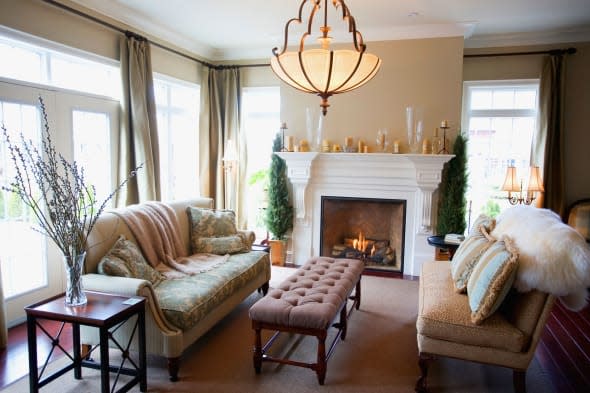 BMETHE A Living Room With A Fireplace.Keywords : Couches, Fireplace, Home, House, Living, Room.  Fancy, richly decorated livi