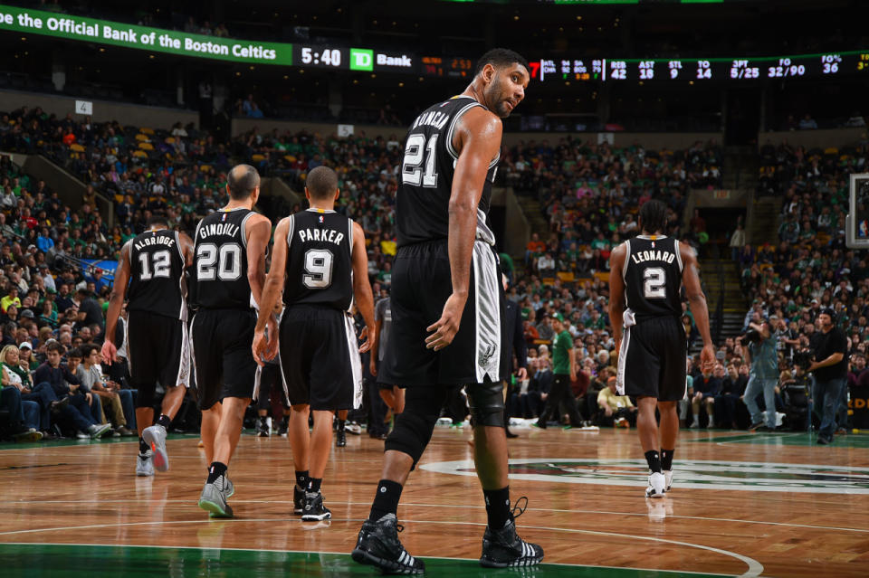 <p>2015: Tim Duncan #21, Manu Ginobili #20 and Tony Parker #9 of the San Antonio Spurs are seen during the game on November 1, 2015 at the TD Garden in Boston, Massachusetts.</p>