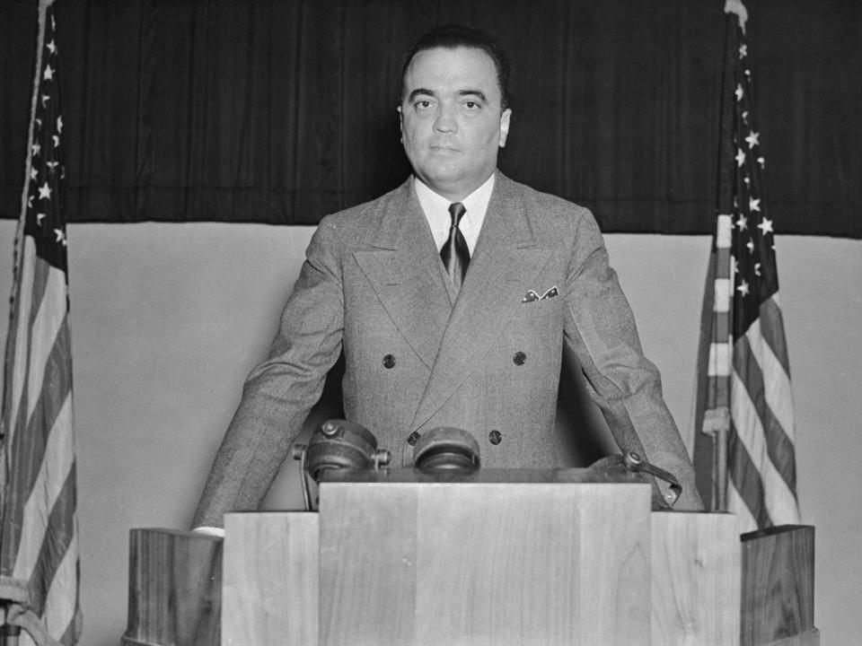 J. Edgar Hoover is shown delivering an address before the 23rd Annual Convention of the International Association for Identification.