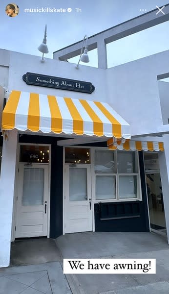 The awning and front door at Something About Her sandwich shop
