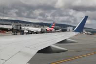 Planes are parked at gates at San Francisco International Airport