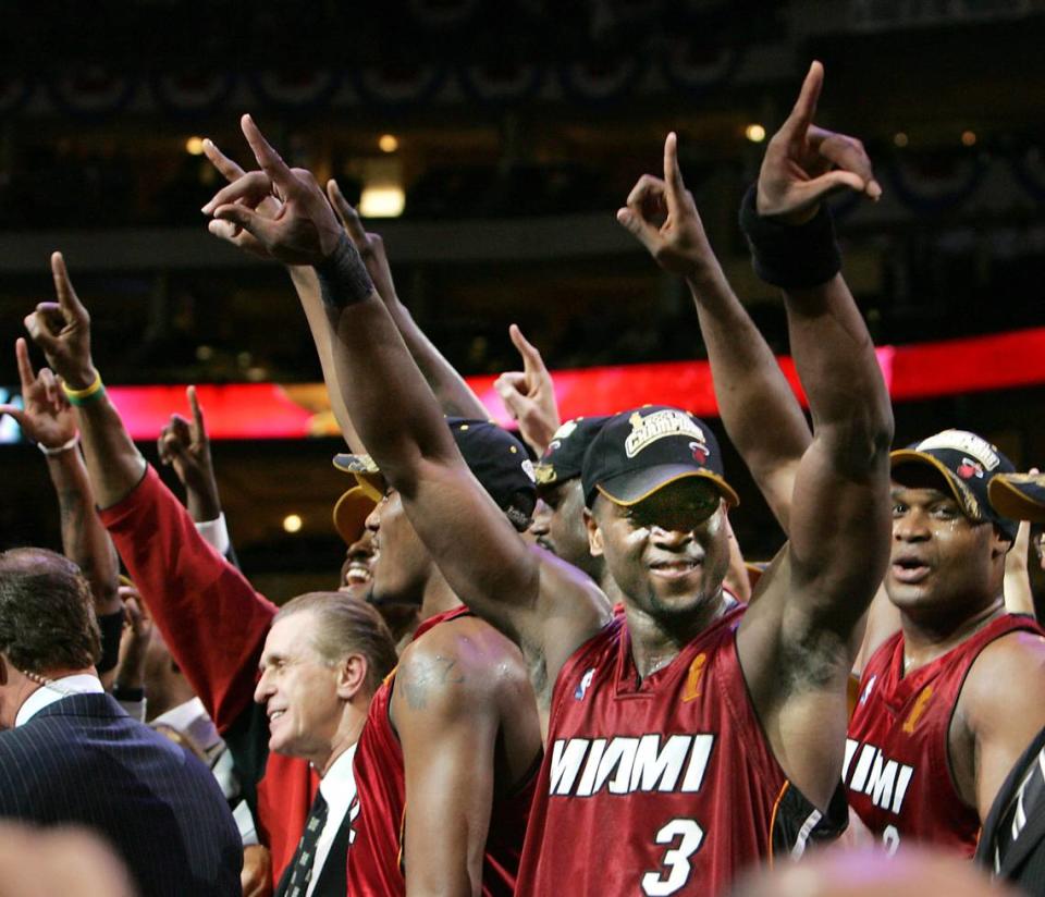 FOR SPORTS -- 6/20/06 -- MIAMI HEAT VS. DALLAS MAVERICKS, GAME 6 NBA FINALS -- MIAMI HERALD STAFF PHOTO BY JARED LAZARUS -- The Miami Heat play the Dallas Mavericks in game SIX of the NBA Finals, Tuesday night, June 20, 2006 at American Airlines Center in Dallas, Texas. Dwyane Wade celebrates with teamates after The Miami Heat defeated The Dallas Mavericks to win The NBA Title. JARED LAZARUS / MIAMI HERALD STAFF