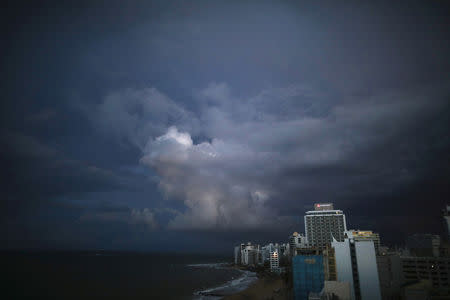 Dark clouds are seen over San Juan after Hurricane Maria hit Puerto Rico, September 29, 2017 REUTERS/Carlos Barria