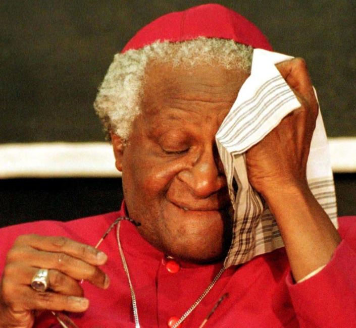 Archbishop Desmond Tutu wipes away tears at TRC meetings