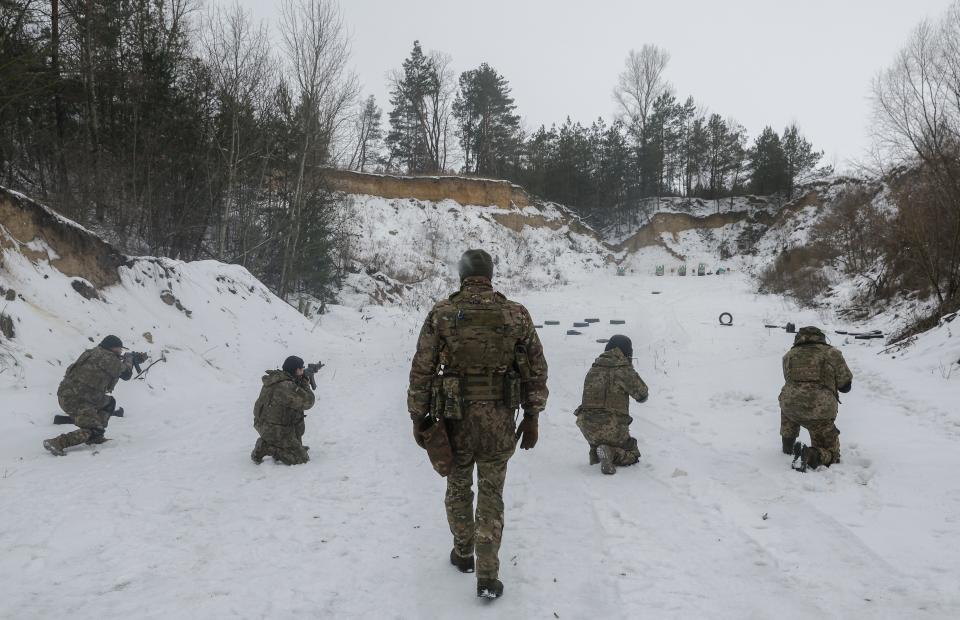 'Siberian Battalion' members attend military training on a shooting range near Kyiv, (EPA)