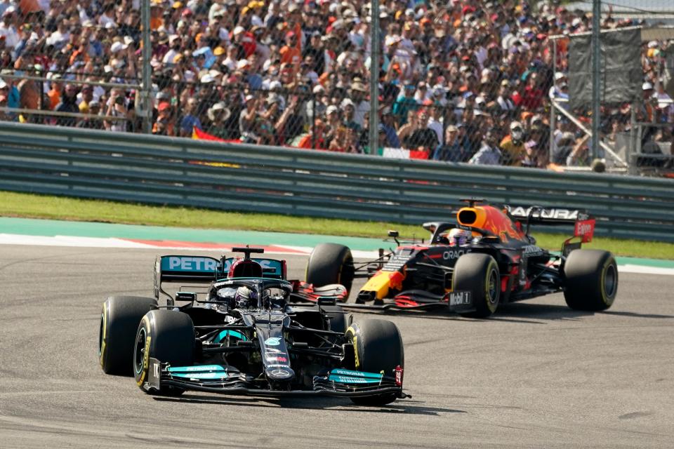 Mercedes driver Lewis Hamilton, of Britain, leads Red Bull driver Max Verstappen, of the Netherlands, during the Formula One U.S. Grand Prix auto race at the Circuit of the Americas, Sunday, Oct. 24, 2021, in Austin, Texas.