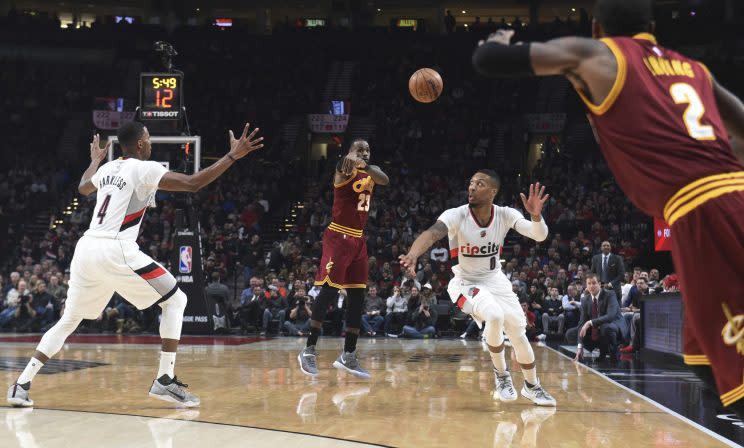 Damian Lillard finds himself caught in the middle of the Kyrie Irving and LeBron James feud. (AP)