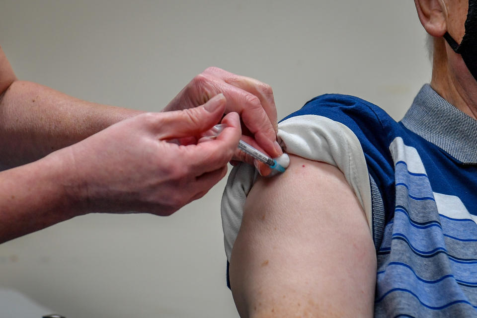 Undated file photo of man receiving a COVID-19 vaccine. The Bank of England is set to hike its forecasts for the UK economy on Thursday as the vaccination programme and easing of lockdown help boost Britain's recovery. Issue date: Monday May 3, 2021.