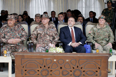 (R-L) Commander of the U.S. Central Command General Joseph Votel, acting U.S. Ambassador to Jordan Henry Wooster, Jordanian Prince Faisal bin Hussein, and Jordanian Chairman of the Joints Chief of Staff Mahmoud Freihat attend the ceremony during which Black Hawk helicopters will be delivered to Jordan from the U.S. government, at a Jordanian military base near the town of Zarqa, Jordan, January 28, 2018.REUTERS/Stringer