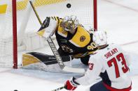 Washington Capitals' Conor Sheary (73) scores against Boston Bruins' Dan Vladar (80) during the first period of an NHL hockey game, Sunday, April 11, 2021, in Boston. (AP Photo/Michael Dwyer)