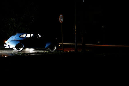 A car drives on a street after Hurricane Irma caused flooding and a blackout, in Havana, Cuba September 10, 2017. Picture taken September 10, 2017. REUTERS/Stringer