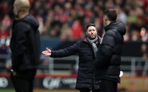 Bristol City manager Lee Johnson gestures to the fourth official during the Carabao Cup semi final, - Credit: PA