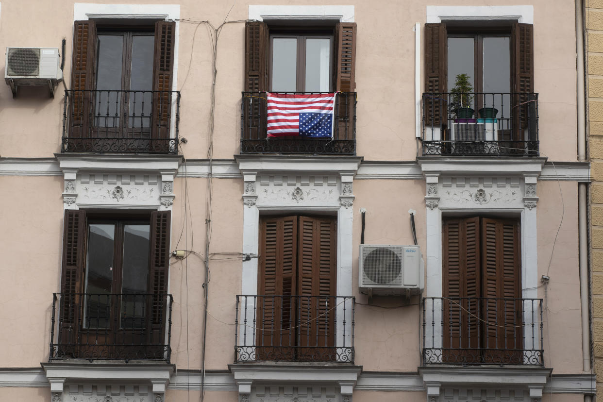 The U.S. flag placed on a balcony of an apartment is hung upside-down, a sign of distress, in Madrid, Spain on Nov. 6, 2020. (Paul White/AP)  