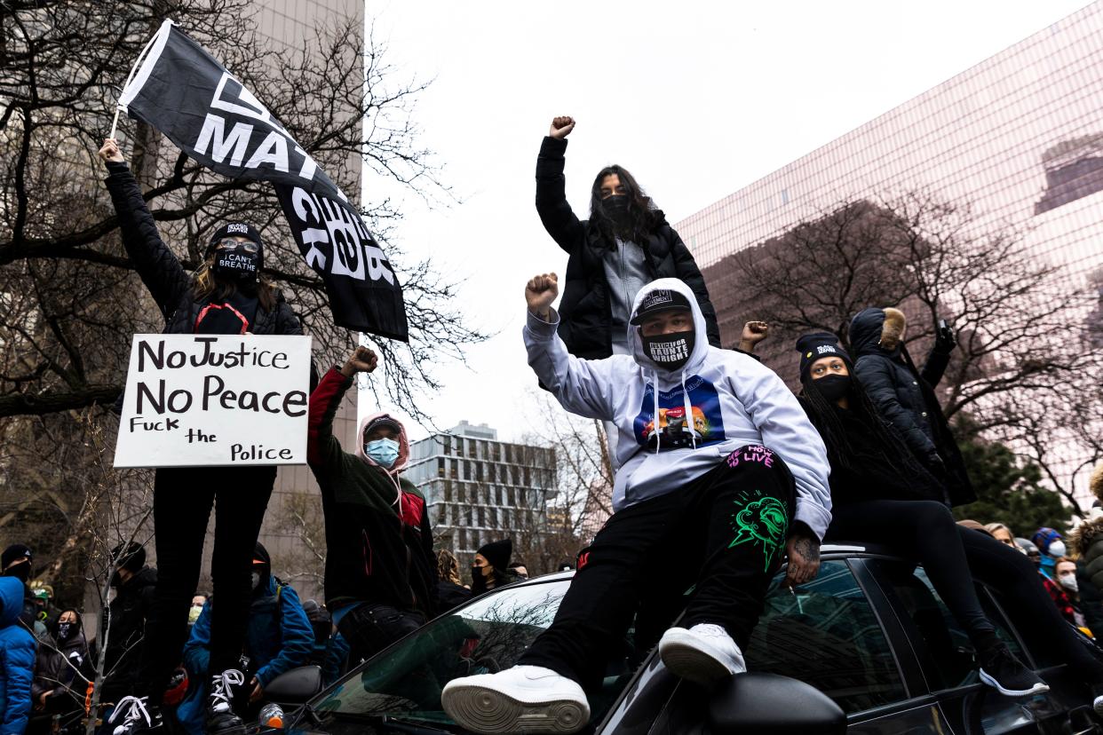 Damik Wright, center, brother of Daunte Wright who was shot and killed by a police officer, at a demonstration in Minneapolis, April 19, 2021