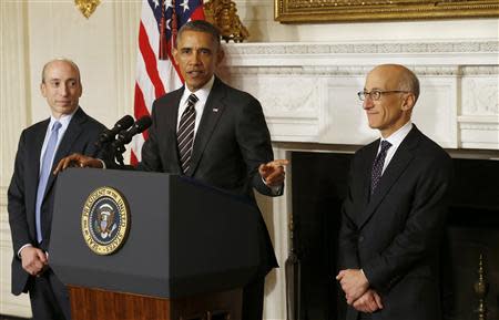 U.S. President Barack Obama nominates Timothy Massad (R) as Chairman of the Commodity Futures Trading Commission (CFTC) at the White House in Washington November 12, 2013. REUTERS/Kevin Lamarque